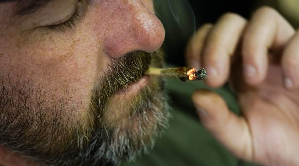 medical marijuana patient smoking weed to get relief