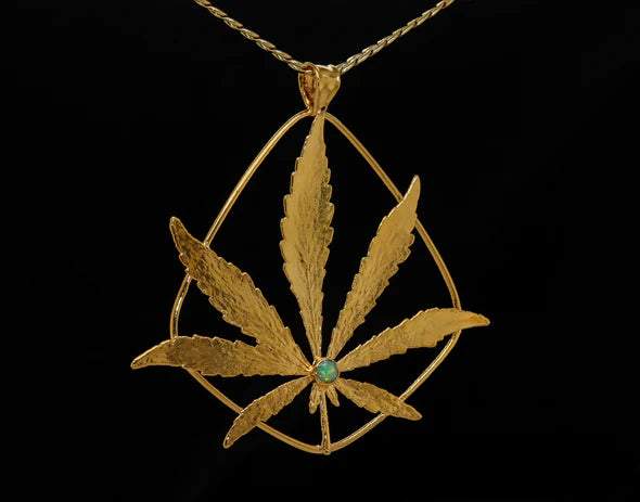 Ras Boss gold coated weed leaf necklace with gemstone