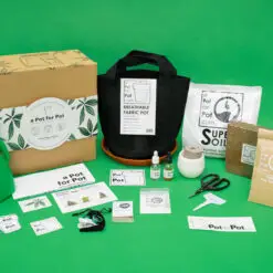 Complete contents of the 2 gallon a Pot for Pot small cannabis grow kit displayed with box, living soil, and tools.