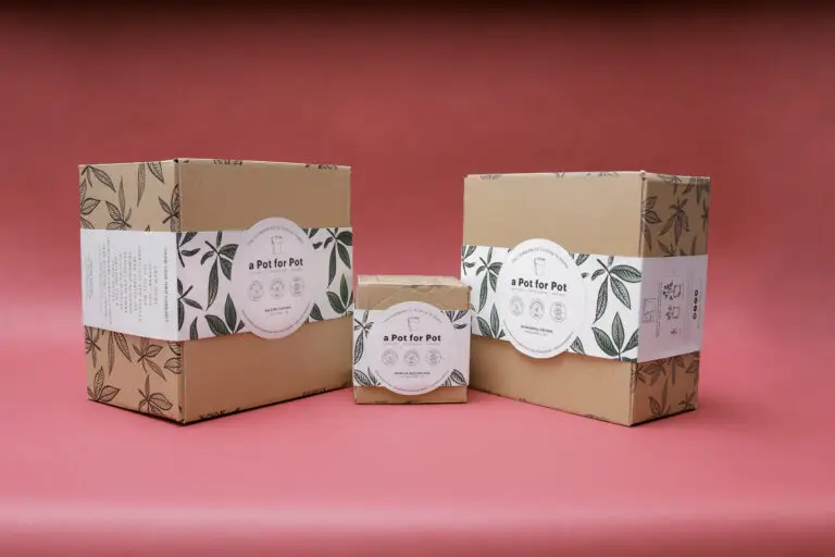 a Pot for Pot grow box packaging displayed on a table, featuring discreet design and all-in-one cannabis cultivation supplies.